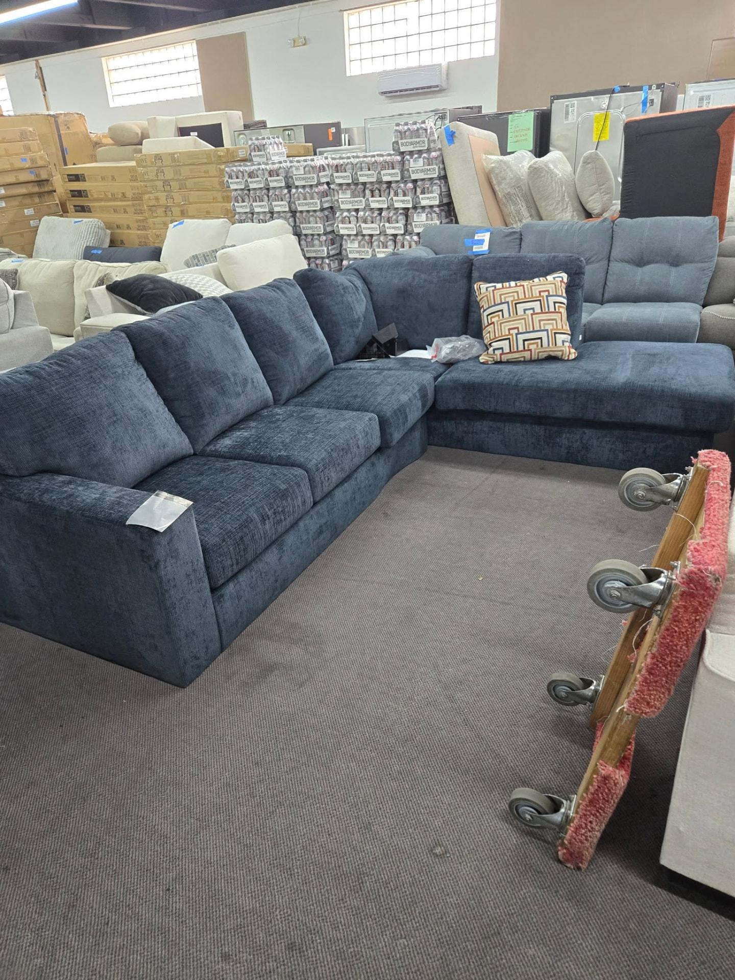 Blue sectional sofa on the Yuma Liquidation showroom floor