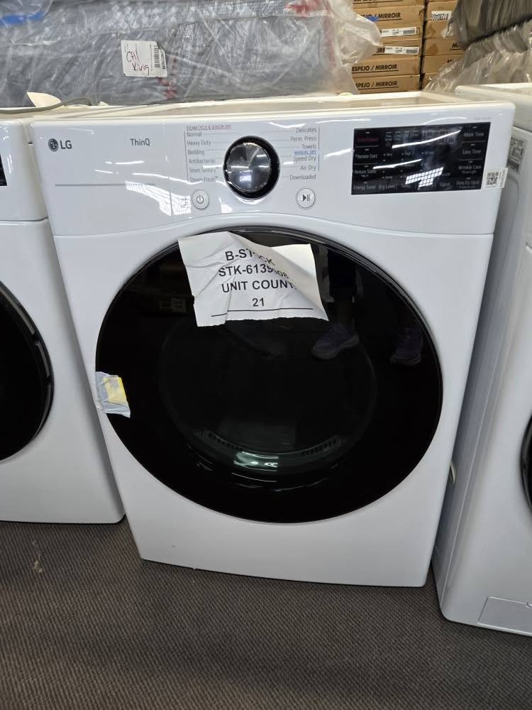 LG front-load washer with a liquidation stock tag