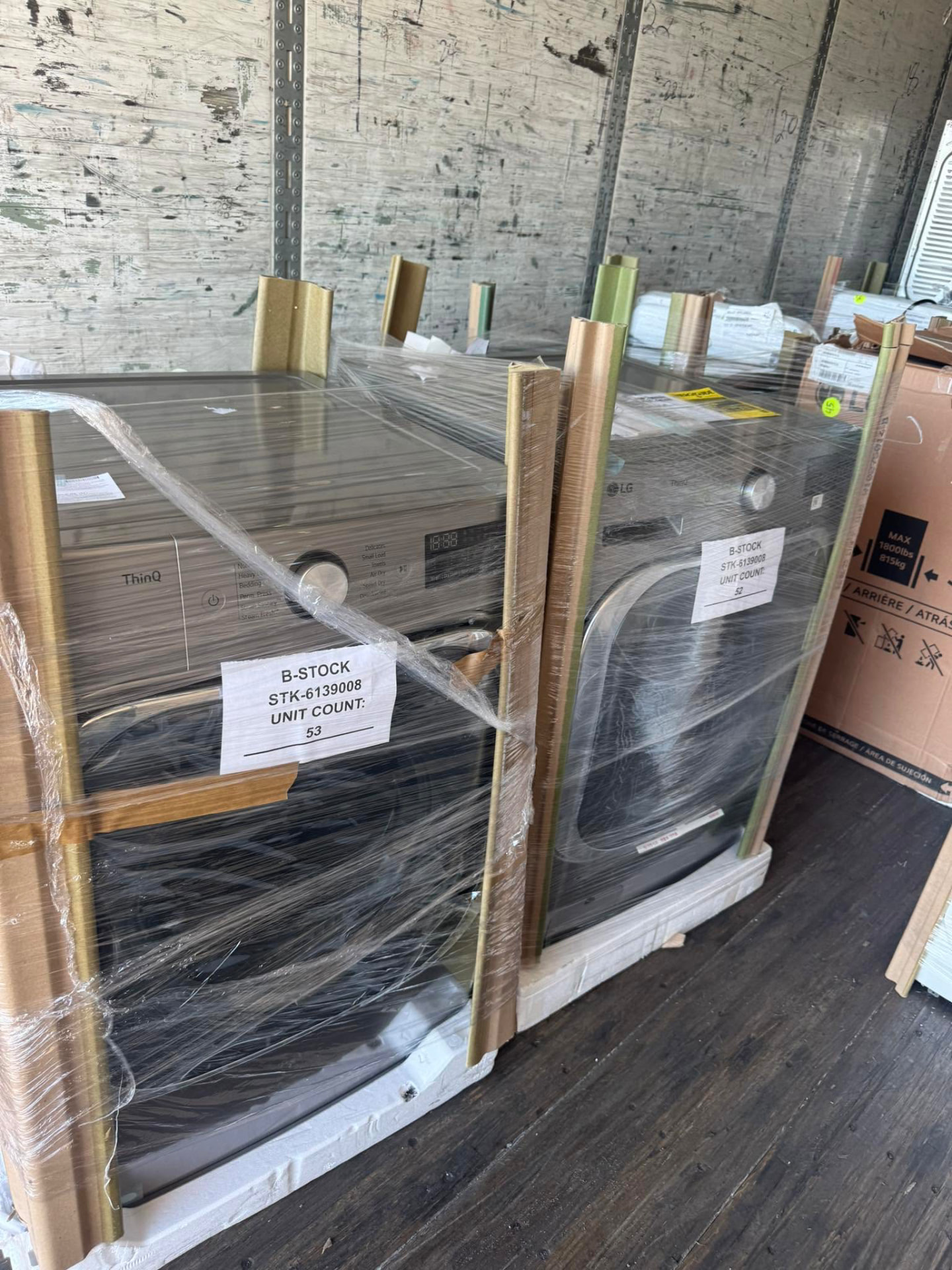 LG washer and dryer pairs wrapped on a delivery truck