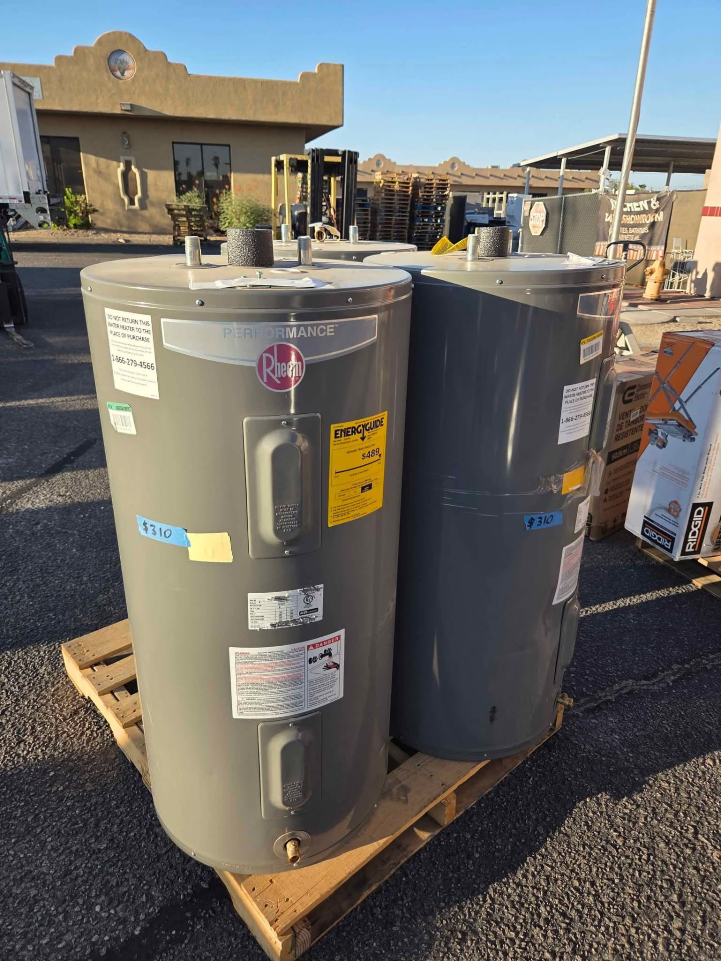 Rheem water heaters on pallets with liquidation price tags