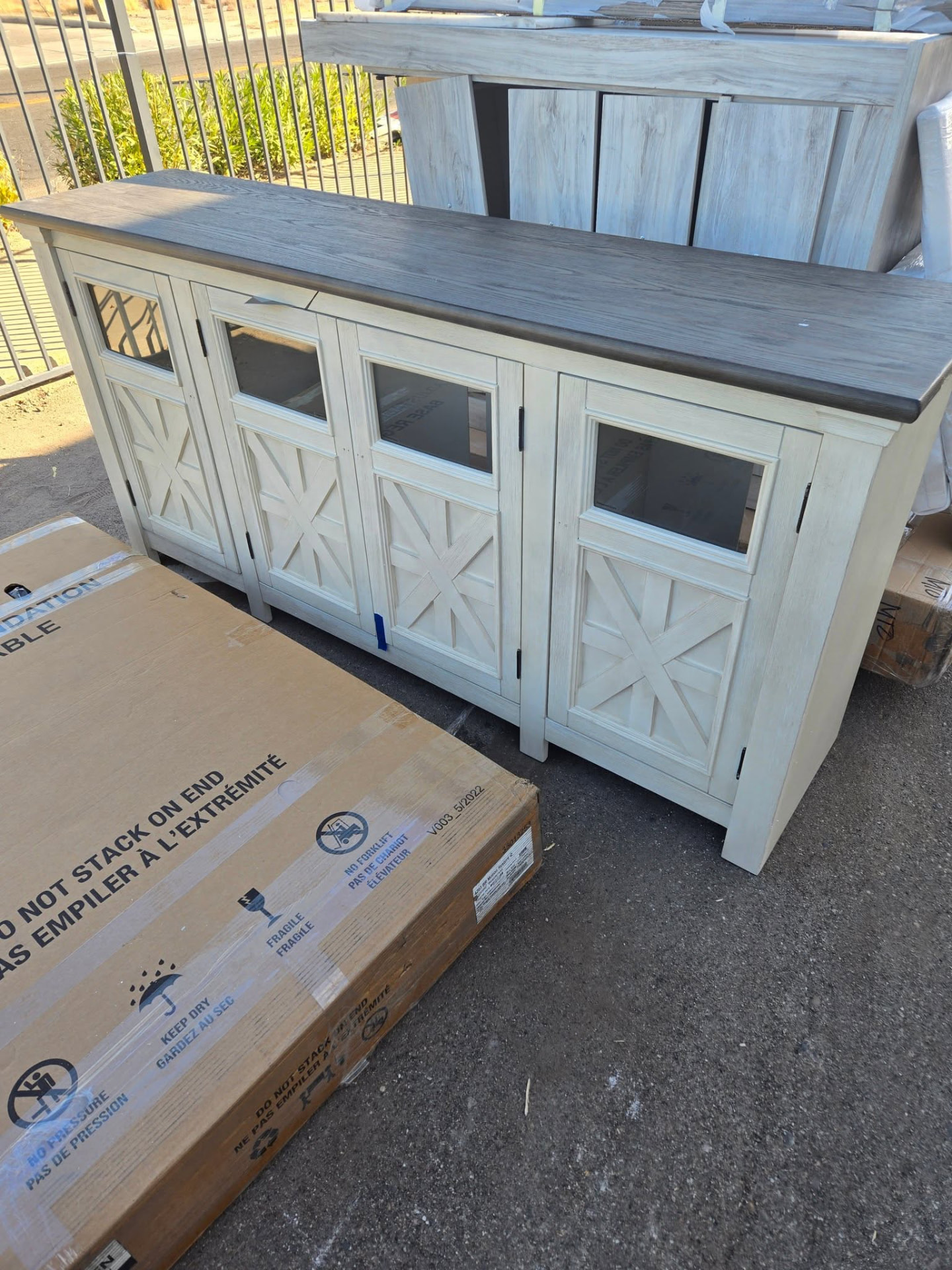 Farmhouse sideboard cabinets outside the store