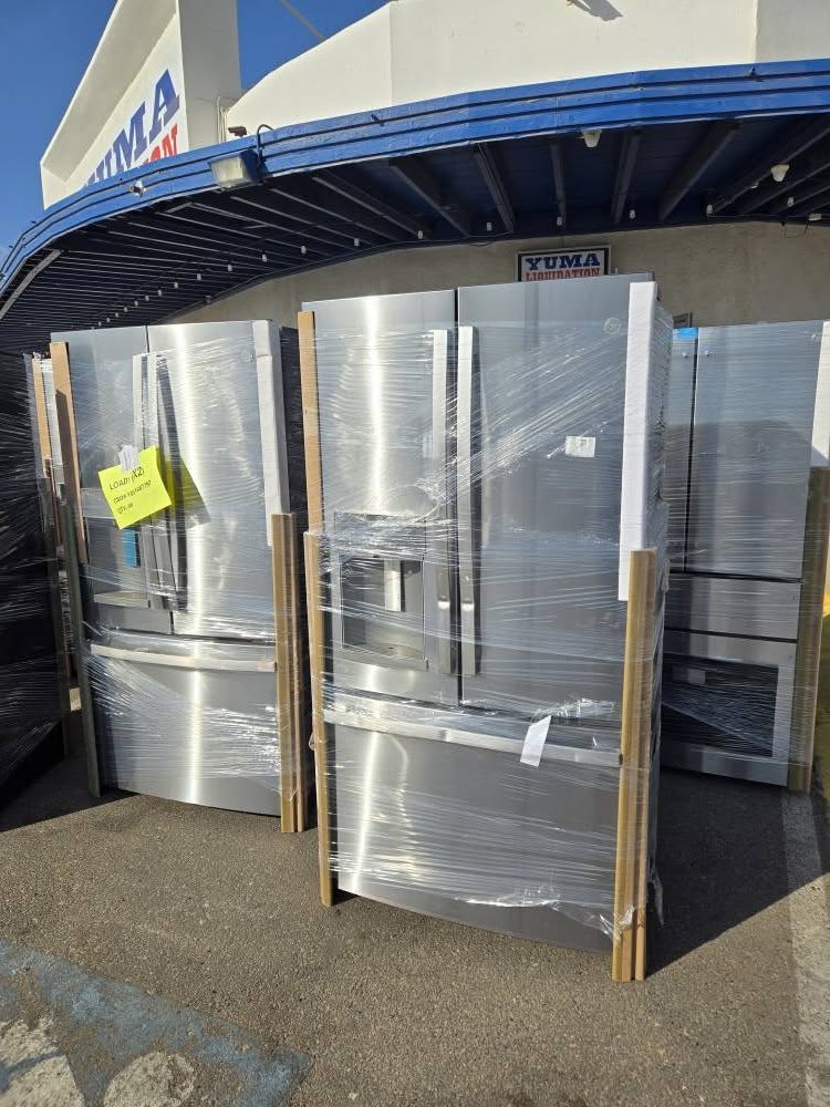 Wrapped stainless refrigerators under the Yuma Liquidation awning